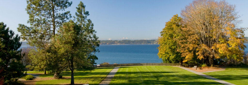 A view of a trees and puget sound from dumas bay retreat center.