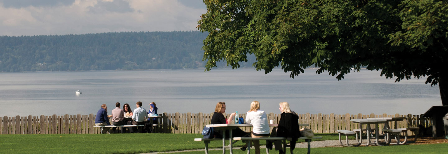 A view of a lunch tables and puget sound from dumas bay retreat center.