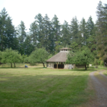 The pavilion in a field of grass at Indralaya Retreat center on Orcas Island, WA