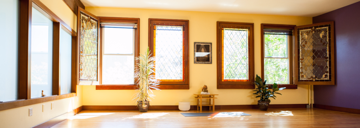 Older windows of the second story yoga studio at 3 Oms yoga