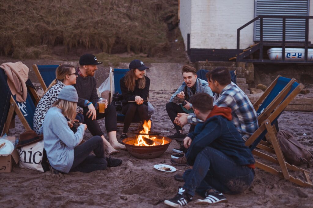 Friends around campfire, listening to a story